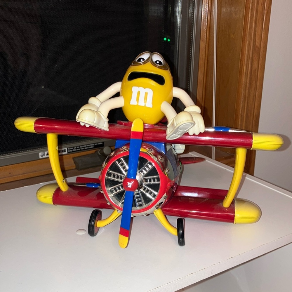 M&M Dispenser Yellow Character on Red Airplane Figurine